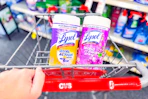 person pushing a cart with 2 containers of lysol wipes in it