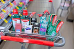 colgate mouthwash, loreal toner, cetaphil soap bar, axe deodorant, toms toothpaste, and colgate toothpaste in a cart