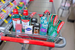 colgate mouthwash, loreal toner, cetaphil soap bar, axe deodorant, toms toothpaste, and colgate toothpaste in a cart