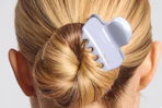 a woman wearing a claw clip