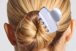 a woman wearing a claw clip
