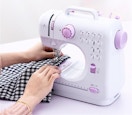 white sewing machine with purple controls