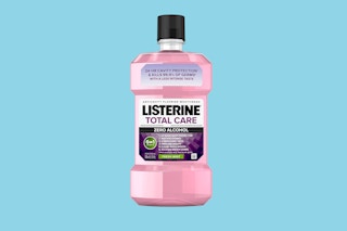 Listerine Total Care Fluoride Mouthwash on a blue background