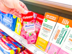 grabbing a colgate max fresh toothpaste off a target shelf