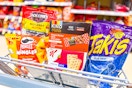 jack link's jerky, kind mini bars, pringles mingles, special k pastry crisps, and takis in a cart