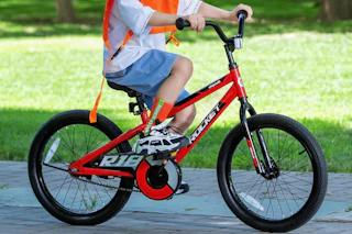 a boy riding a bicycle