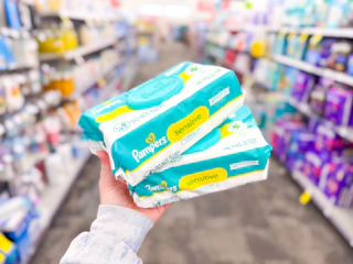 hand holding pampers wipes in cvs