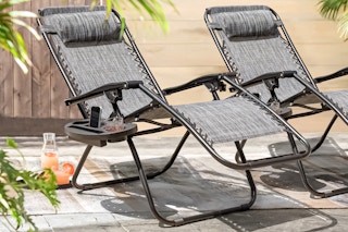 Lifestyle image of two Lacoo Zero Gravity Chairs outdoors