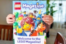 lego magazine being held out by a kid 