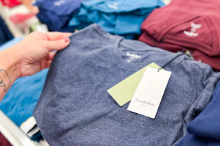 hand grabbing a goodfellow & co men's t-shirt off a target shelf