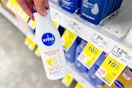 person holding a bottle of nivea lotion