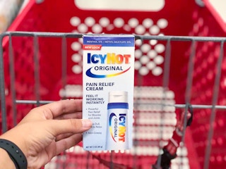 hand holding icy hot pain relief cream at target