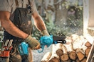 a man using a mini chainsaw