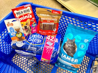 nylabone dog toy, milk bone treats, dog chews, fresh step cat litter, and iams cat food in a cart