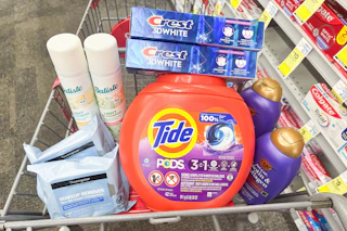 batiste dry shampoo, neutrogena wipes, tide pods, crest toothpaste, and ogx shampoo in a cart