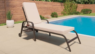 a lounger chair by a pool