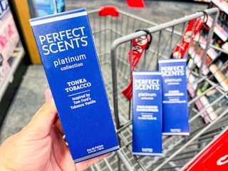 someone holding up a Tonka Tobacco Perfect Scents product