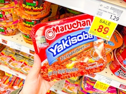 hand holding a pack of maruchan yakisoba noodles