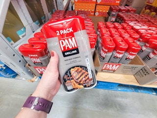 hand holding a 2-pack of Pam grilling spray
