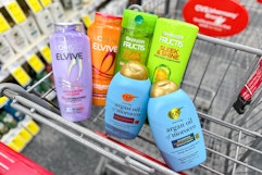 loreal elvive, garnier fructis, and ogx hair care in a cart