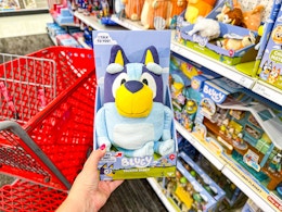 hand holding a bluey sound effects plush at target