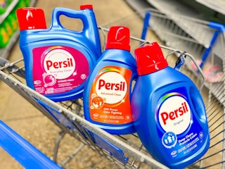 three bottles of persil liquid detergent in walmart cart
