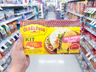 hand holding an old el paso taco kit in a walgreens aisle