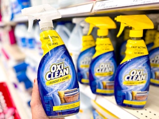 hand holding oxiclean laundry stain remover at target