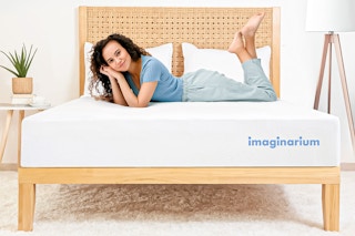 Lifestyle image of woman laying on a king sized mattress from Imaginarium