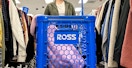 a person pushing a cart in ross