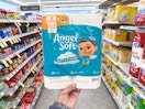 hand holding angel soft toilet paper in walgreens