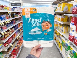 hand holding angel soft toilet paper in walgreens