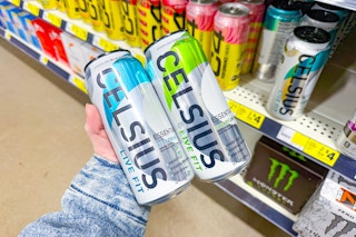 hand holding celsius energy drinks