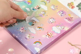 a hand opening up an advent calendar