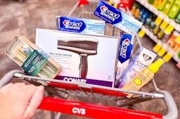 cvs shopping cart with ecotools, conair, crest, and sun bum products