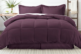 Lifestyle image of the purple Ienjoy comforter set in purple displayed on bed