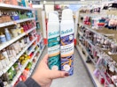 hand holding batiste dry shampoos in walgreens