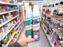 hand holding batiste dry shampoos in walgreens