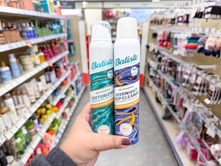 hand holding batiste dry shampoos in walgreens