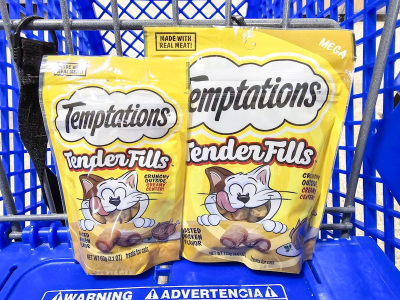 2 bags of cat treats in a blue cart