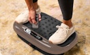 a person standing on a vibration plate