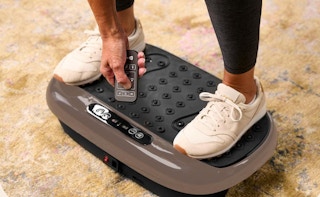 a person standing on a vibration plate