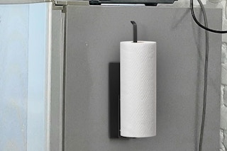 a magnetic paper towel holder on a fridge