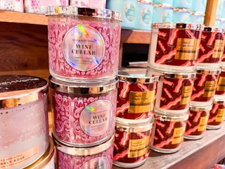 variety of 3 wick candles on shelf