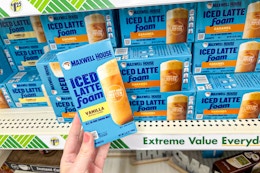 hand holding a box of maxwell house iced latte with foam drink mix at dollar tree
