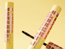 yellow and rose gold tubes of mascara