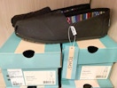 toms shoes on top of shoe boxes in macys