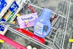 snuggle dryer sheets and fabric softener in a cart