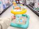 bright starts disney pooh walker sitting in a target aisle