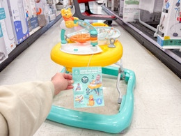 bright starts disney pooh walker sitting in a target aisle